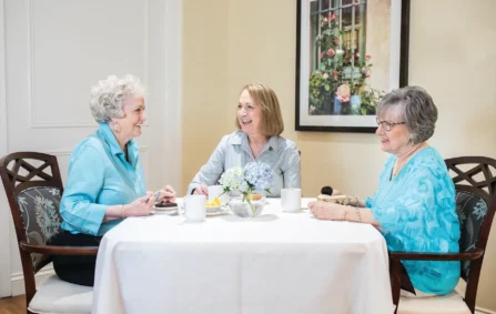 Three women enjoying coffee together at a table
